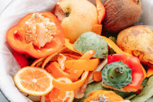 Organic leftover vegetables and fruits in a compost bin