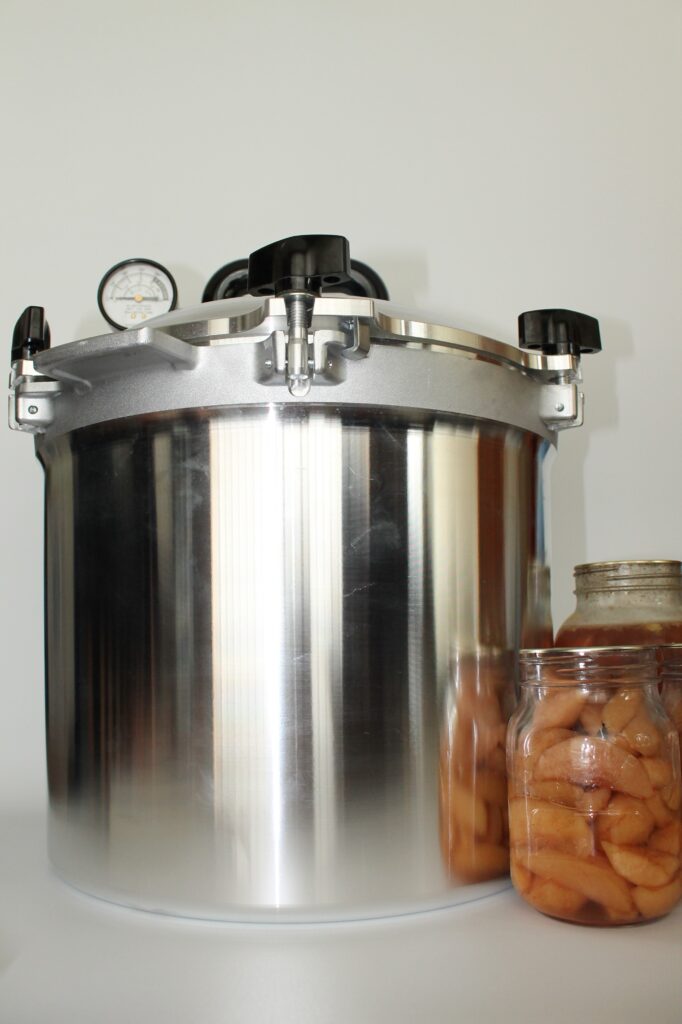 All american canner with jars of preserved food