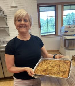 Woman holding fresh baked focaccia bread